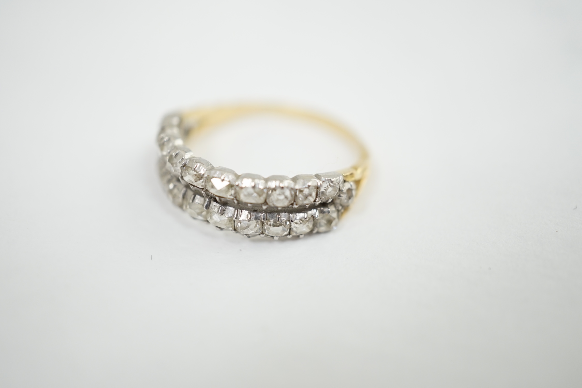 A late Victorian gold and two row old mine cut diamond cluster set half hoop ring